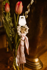 Parel haaraccesoire met strik roze